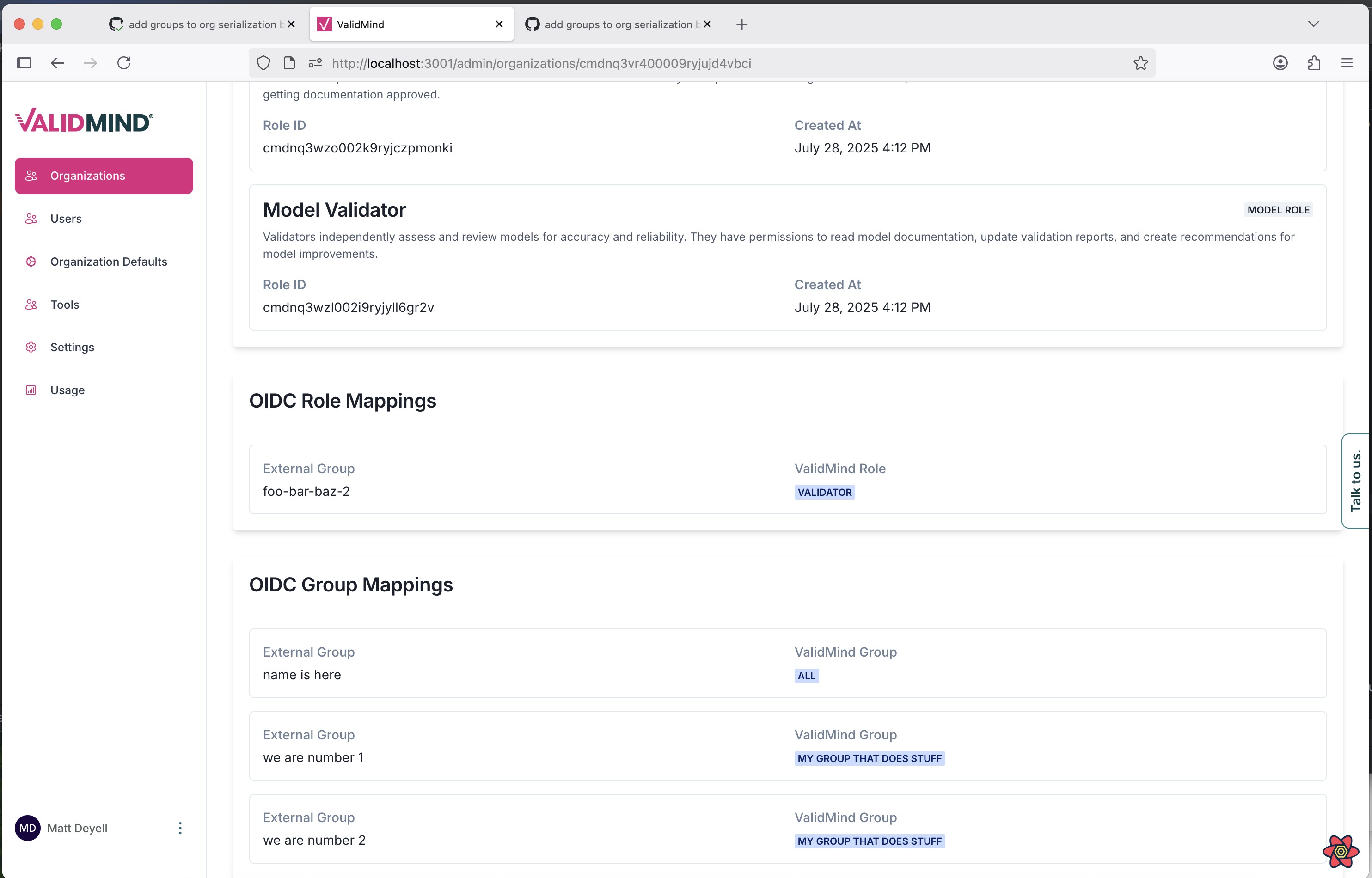 A web interface titled Model Validator displays details about a model with a unique ID and creation date, showing Role ID and Client ID values. Below, sections for OIDC Role Mappings and OIDC Group Mappings list entries with fields for External Group, Validated Role, and Validated Group, each containing specific data values. The interface features a sidebar on the left with menu items including Users, Organization Defaults, and Settings, highlighted in pink. A vertical tab labeled Table on the right edge provides additional navigation. The overall layout is clean with a white background and sections separated by thin gray lines for clarity.